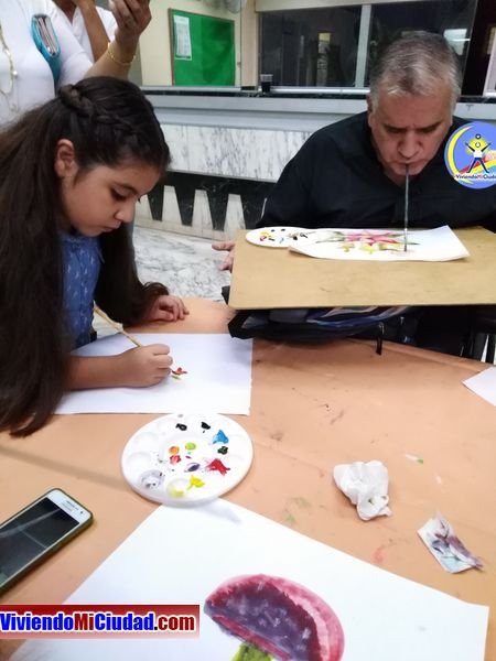 Joel Ramos en el Dia Munidal Pintor Boca y Pie